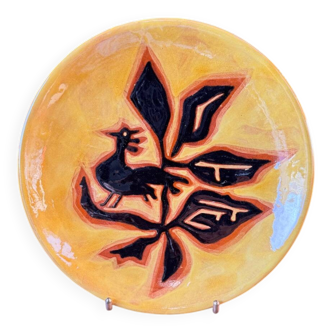 Terracotta plate, Jean Lurçat decorated with a rooster and foliage.