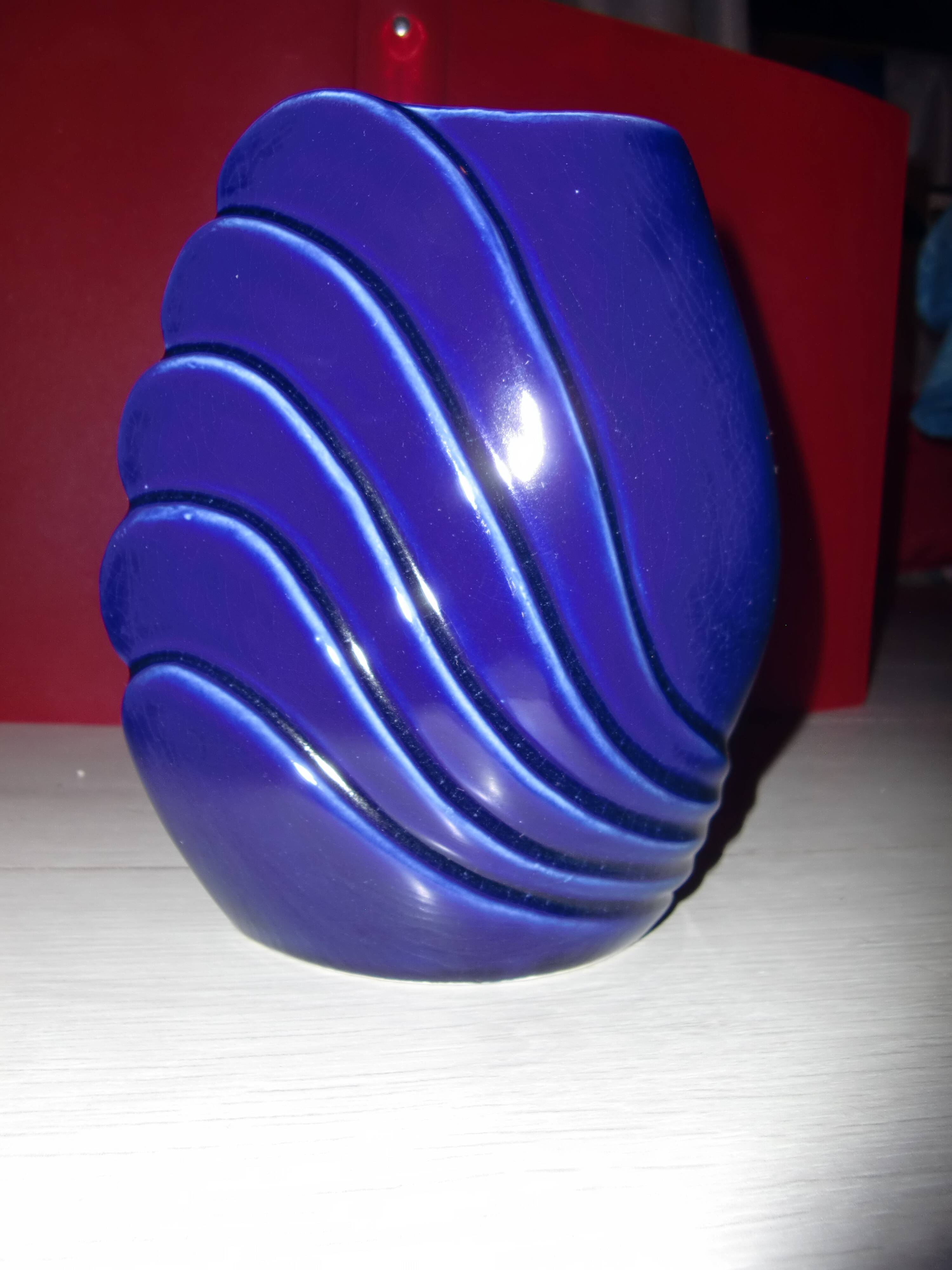 Blue lacquered vase with flowers & applied leaves