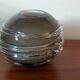 Smoky glass spherical vase with spiral applications from the 1970s.