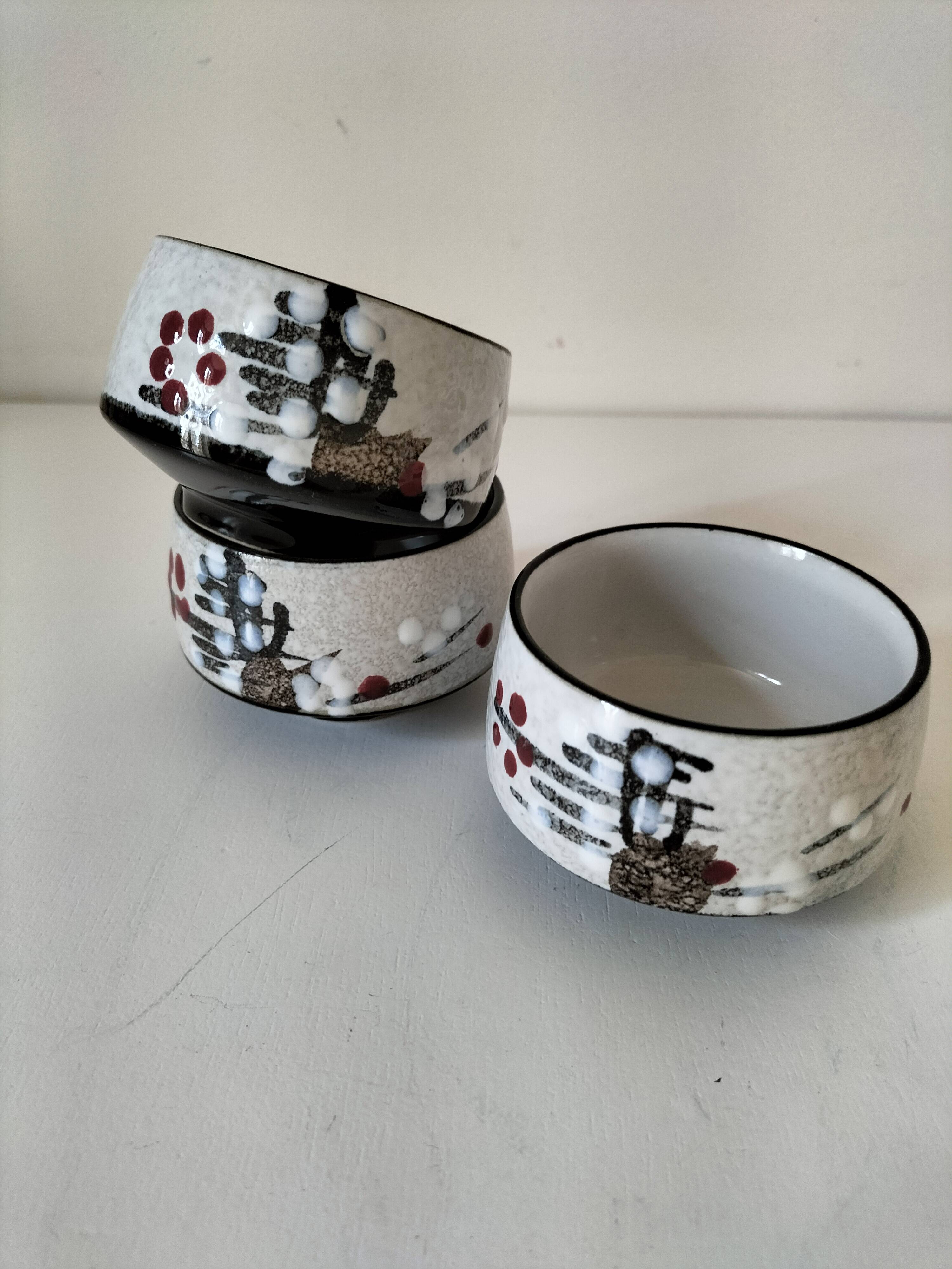 Three glazed ceramic bowls with raised graphic decoration, 1970s.