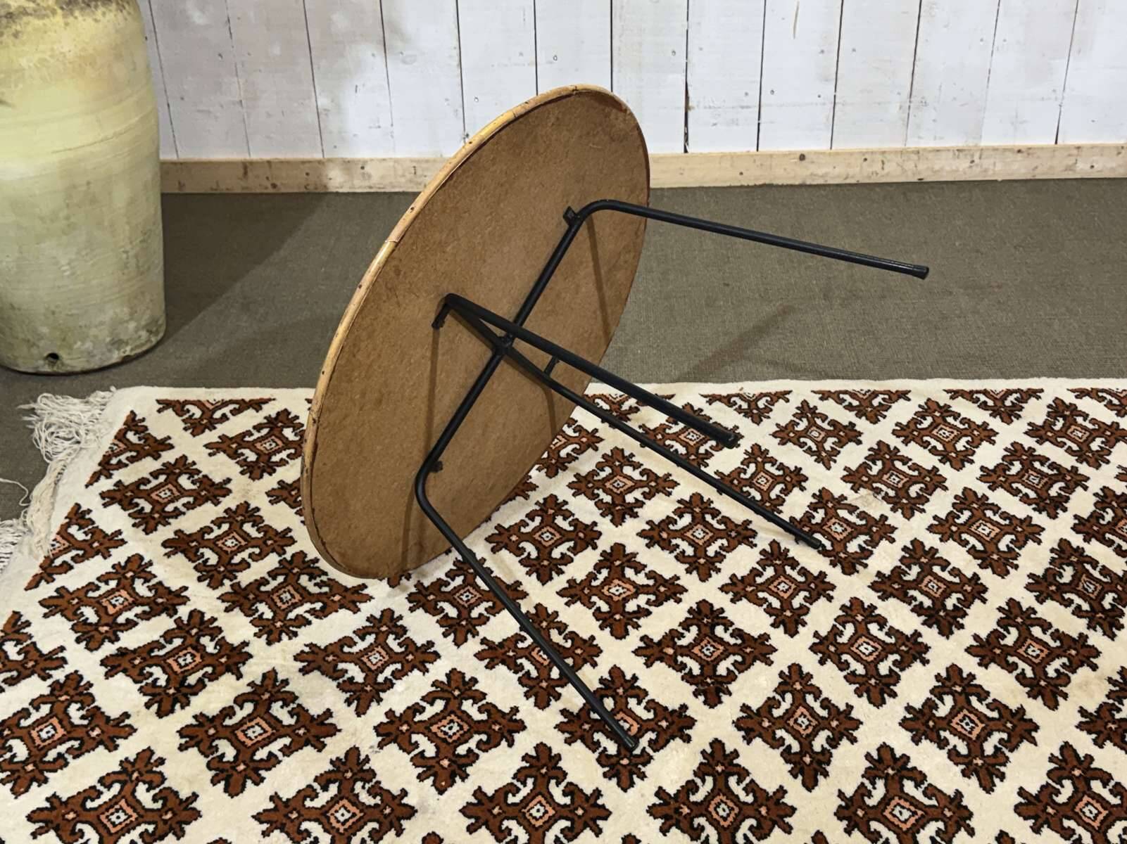 1970s guéridon in rattan with a metal base.
