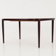 Oval table, covered with rosewood veneer.Design of the 70s
