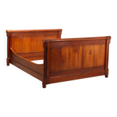 Antique double bed in Empire style made of cherry wood, Italy, 20th century.