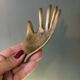 Vintage brass hand ashtray/trinket tray
