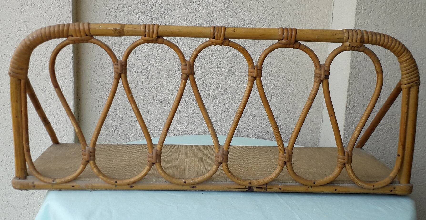 Rattan wall shelf