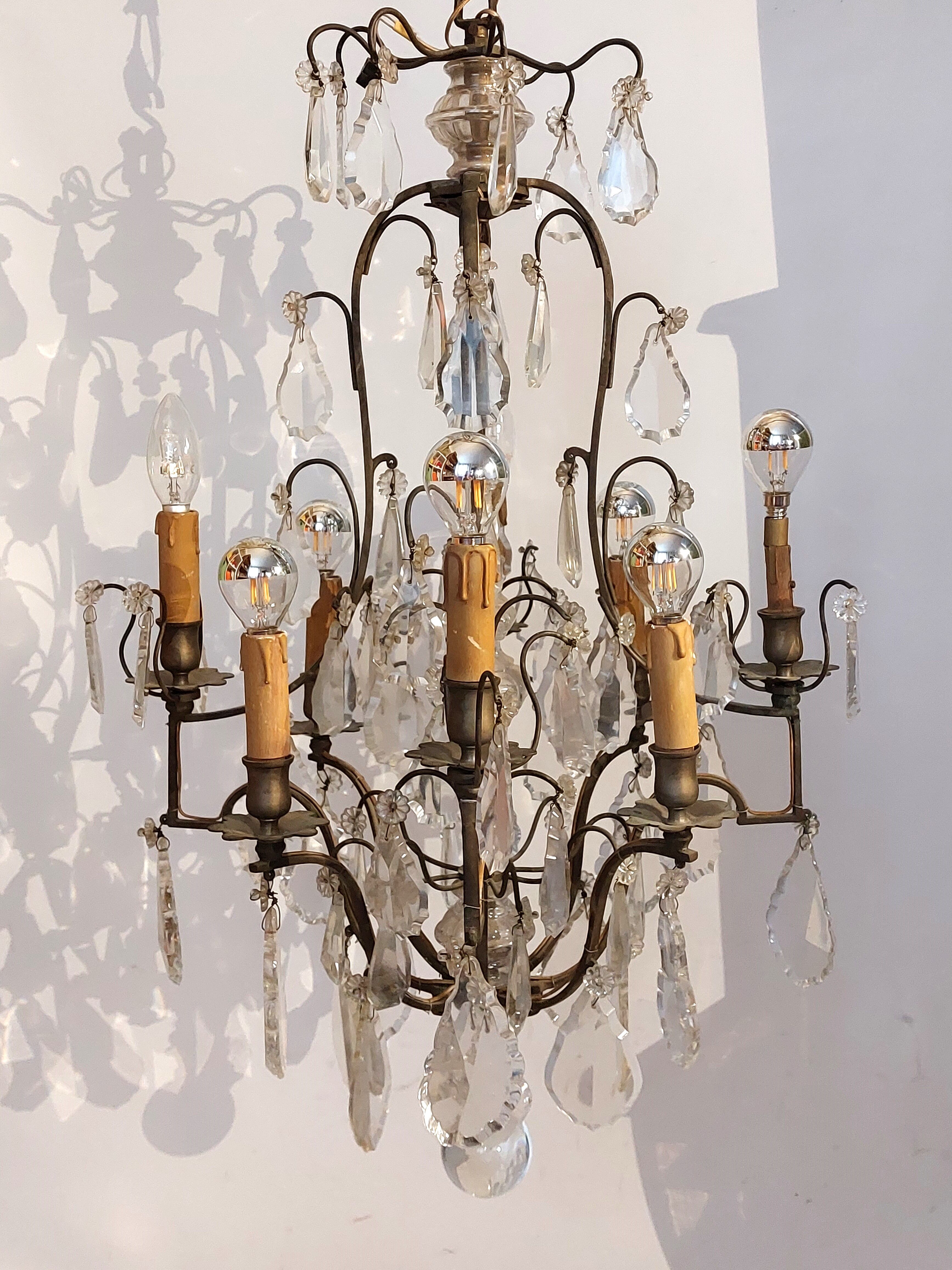 Neoclassical bronze chandelier with 8 lights, tassels and dagger