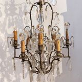 Neoclassical bronze chandelier with 8 lights, tassels and dagger