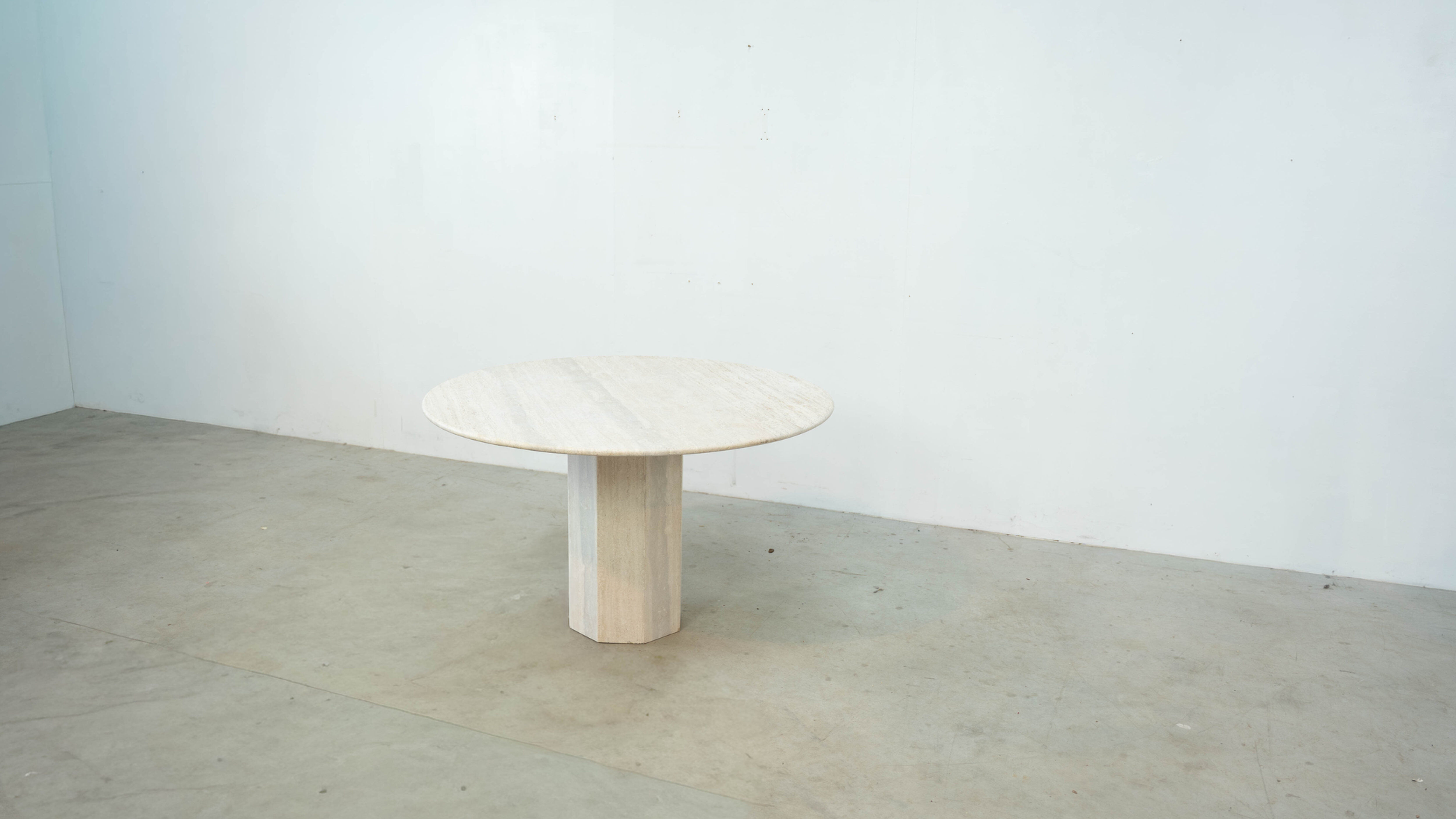 Round Belgian travertine dining table