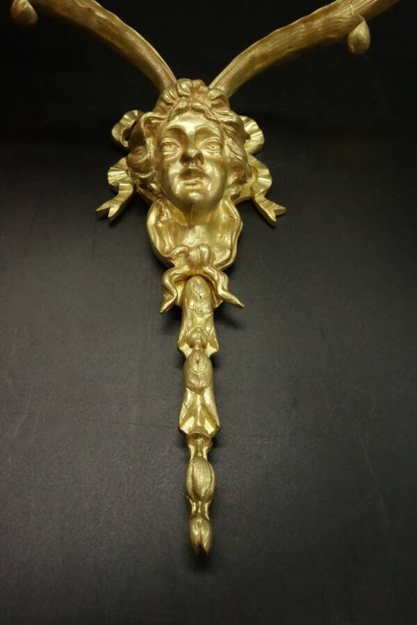 Pair of large Louis XVI style sconces with male faces - bronze
