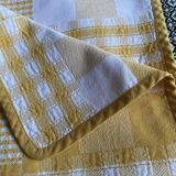 Vintage rectangular reversible cotton tablecloth with yellow and white Vichy checks and squares.