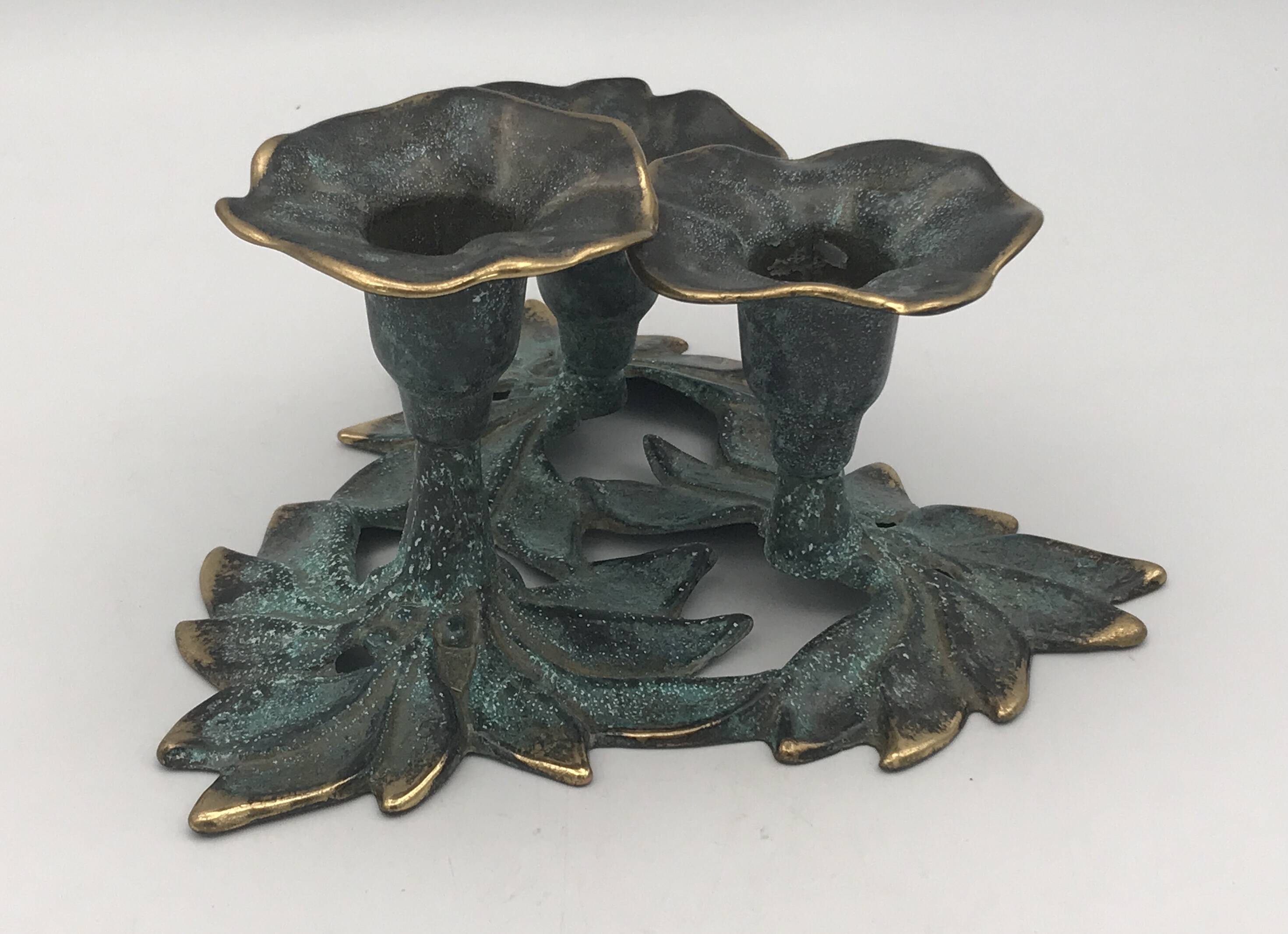 3-flower brass candlestick with green patina