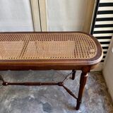 Piano bench in dark wood and cane