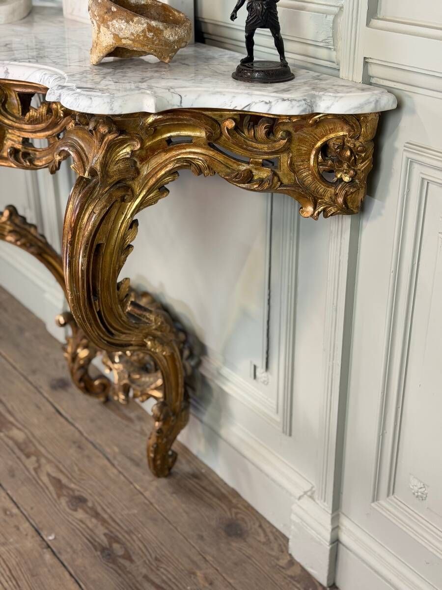 Louis XV style console in carved and gilded wood, circa 1880.