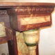 19th century wooden fireplace, faux marble paint. Can act as a console.