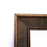 Mirror in gold frame.