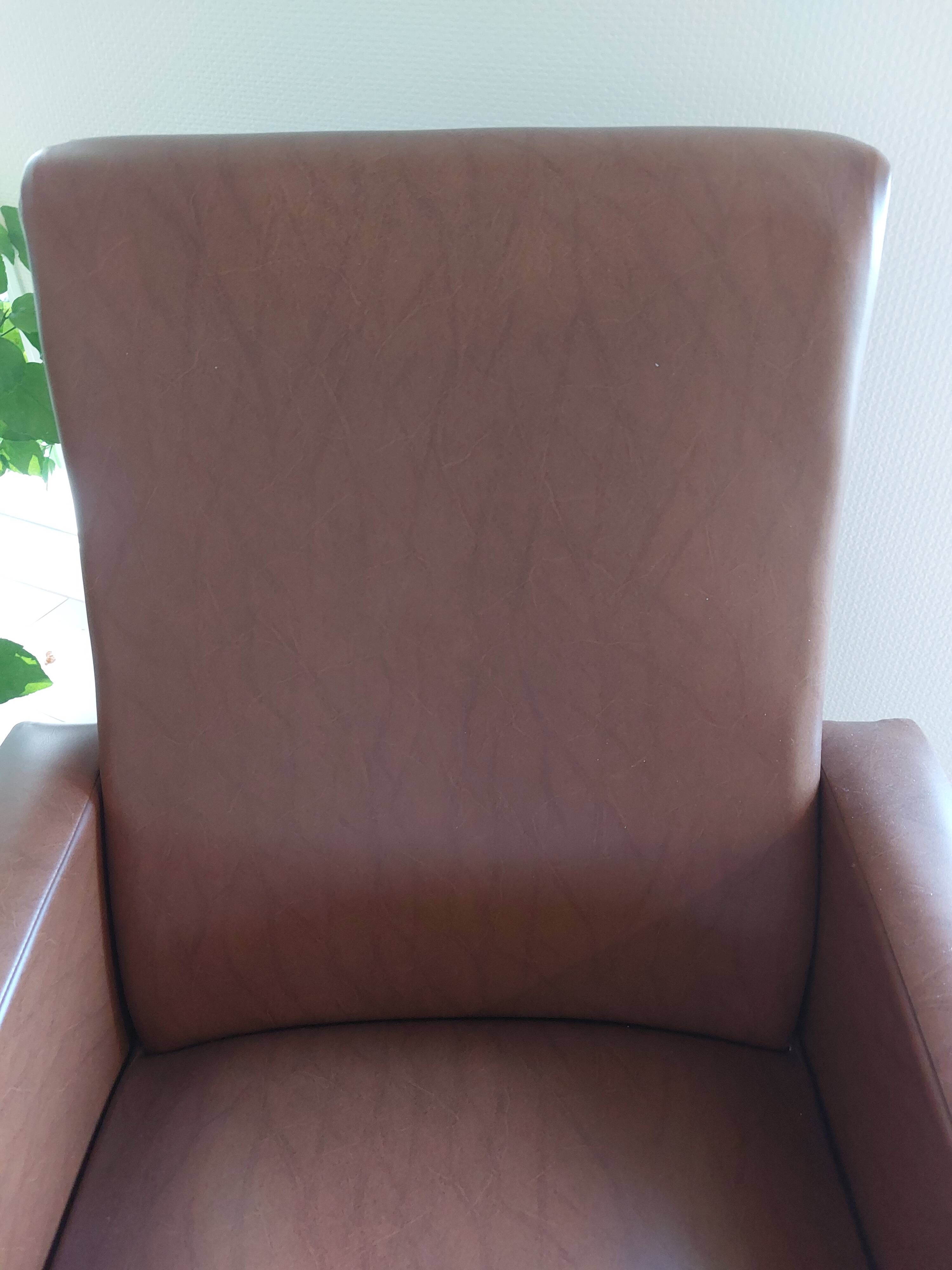 a pair of comfortable vintage armchairs with splayed legs