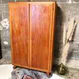 Vintage wooden cabinet with compass feet