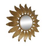 Old sun mirror with foliage in gilded metal with twisted frieze from the 60s