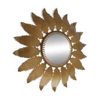 Old sun mirror with foliage in gilded metal with twisted frieze from the 60s
