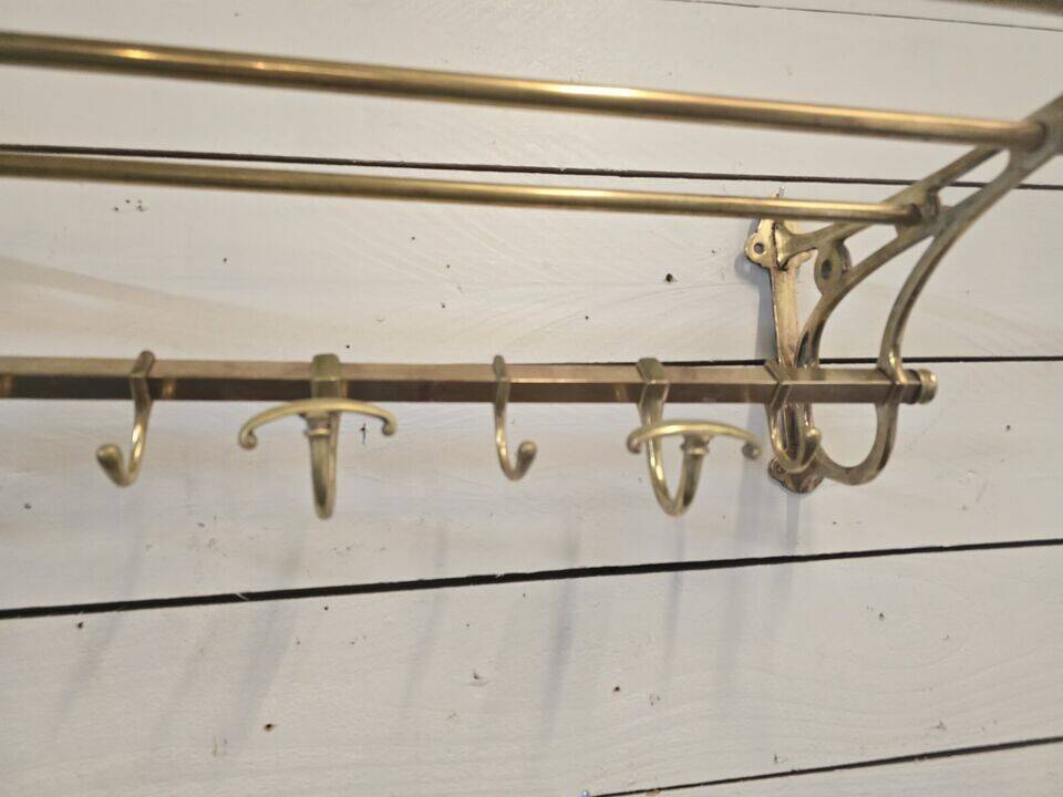 Wall-mounted coat rack with brass hat rack