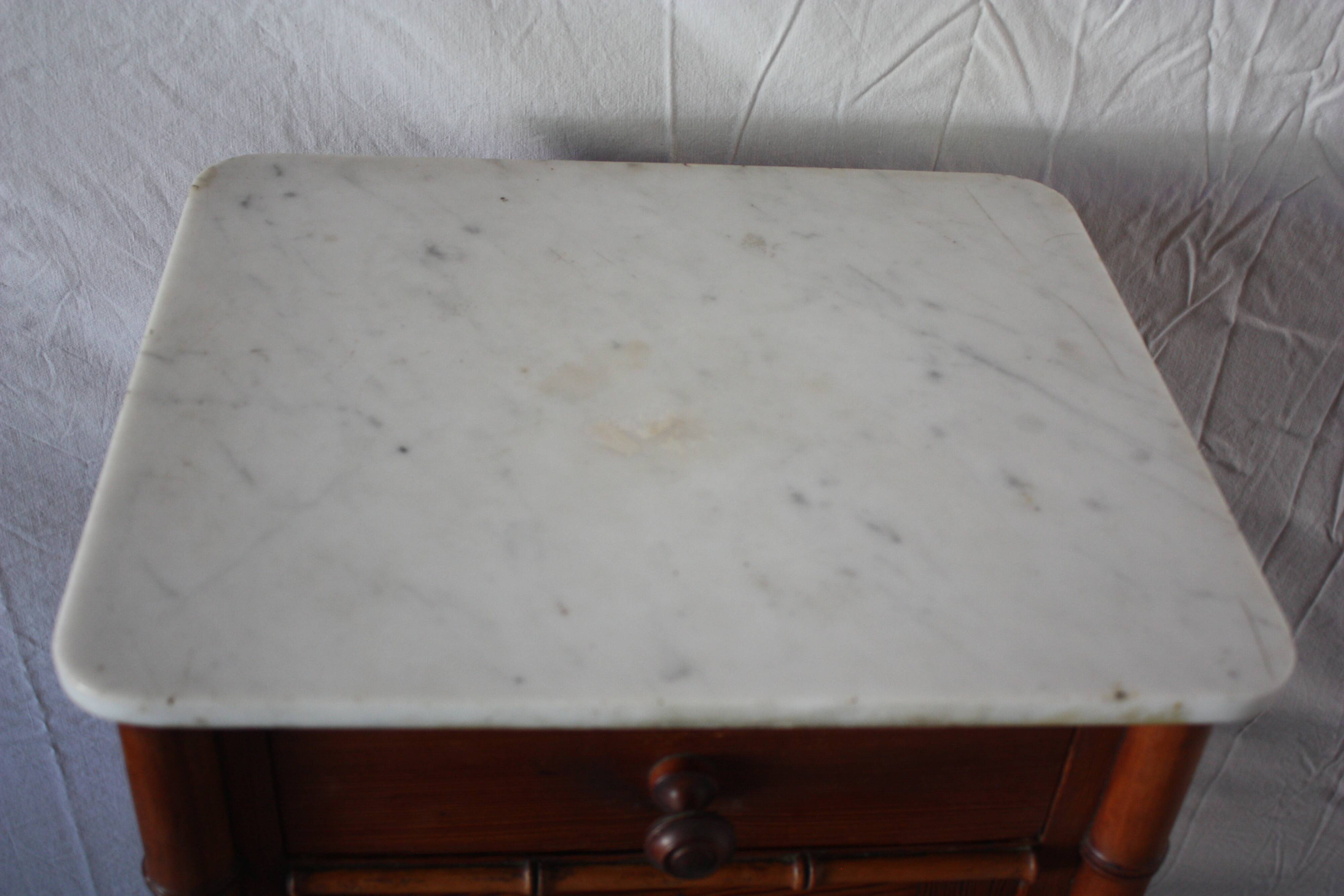 Pitchpin and bamboo beside table 1900