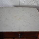 Pitchpin and bamboo beside table 1900