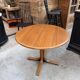Modular round teak table with central base by Osvaldo Borsani.