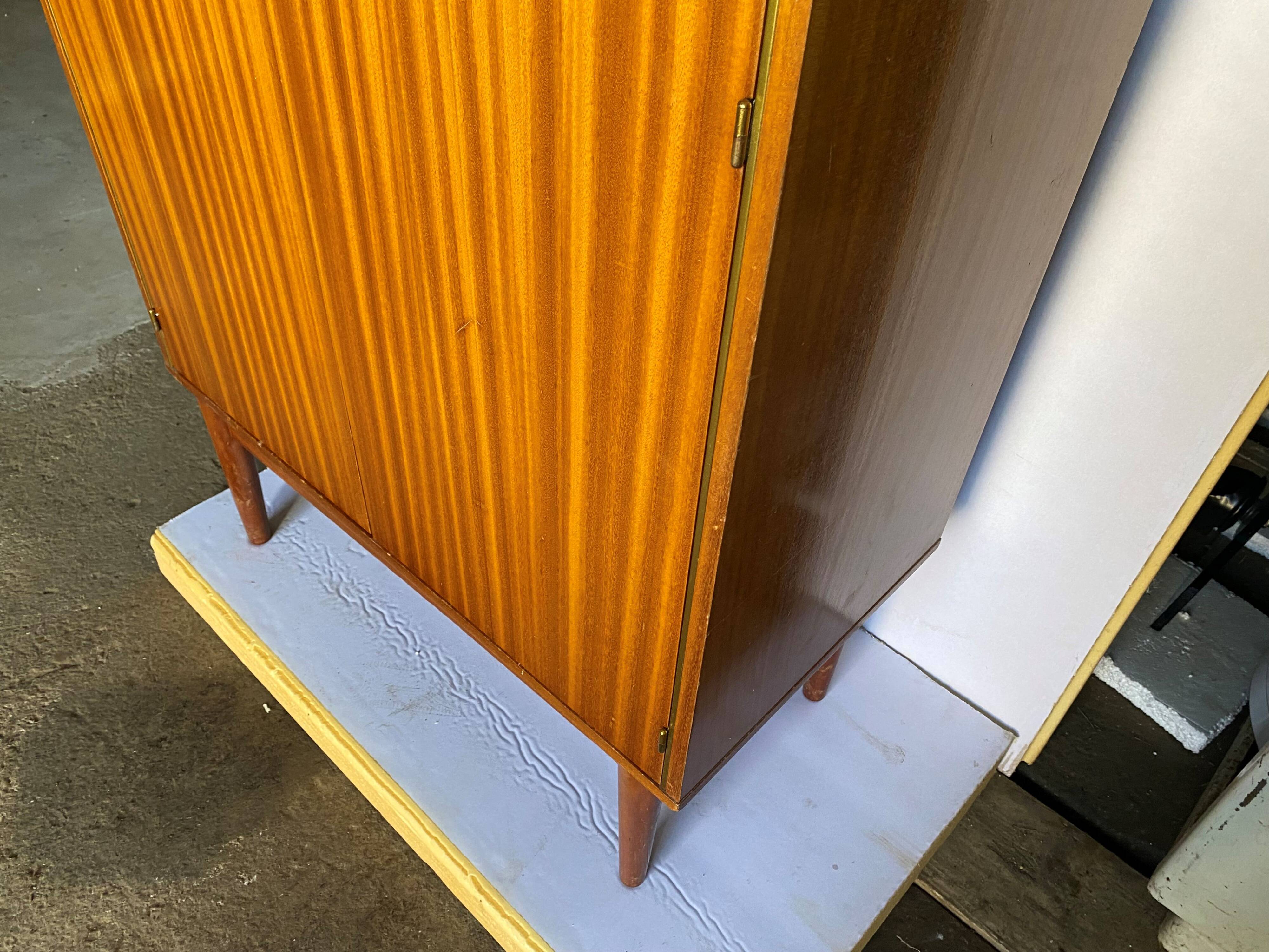 High cabinet with 2 doors in teak and vintage veneer from the 60s