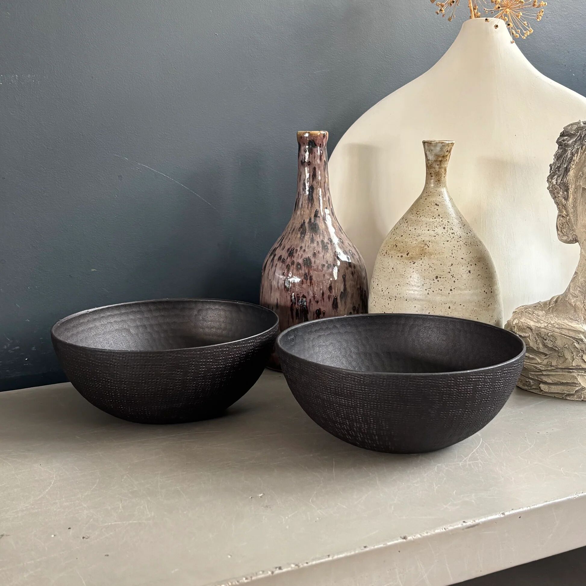 Pair of black lacquered metal catchall bowls