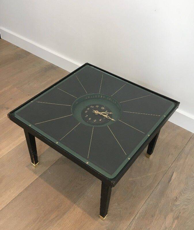 Rare small clock table in leather and brass. In the style of Jacques Adnet.