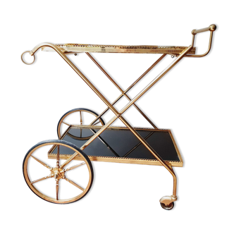 Vintage golden metal dessert on wheels