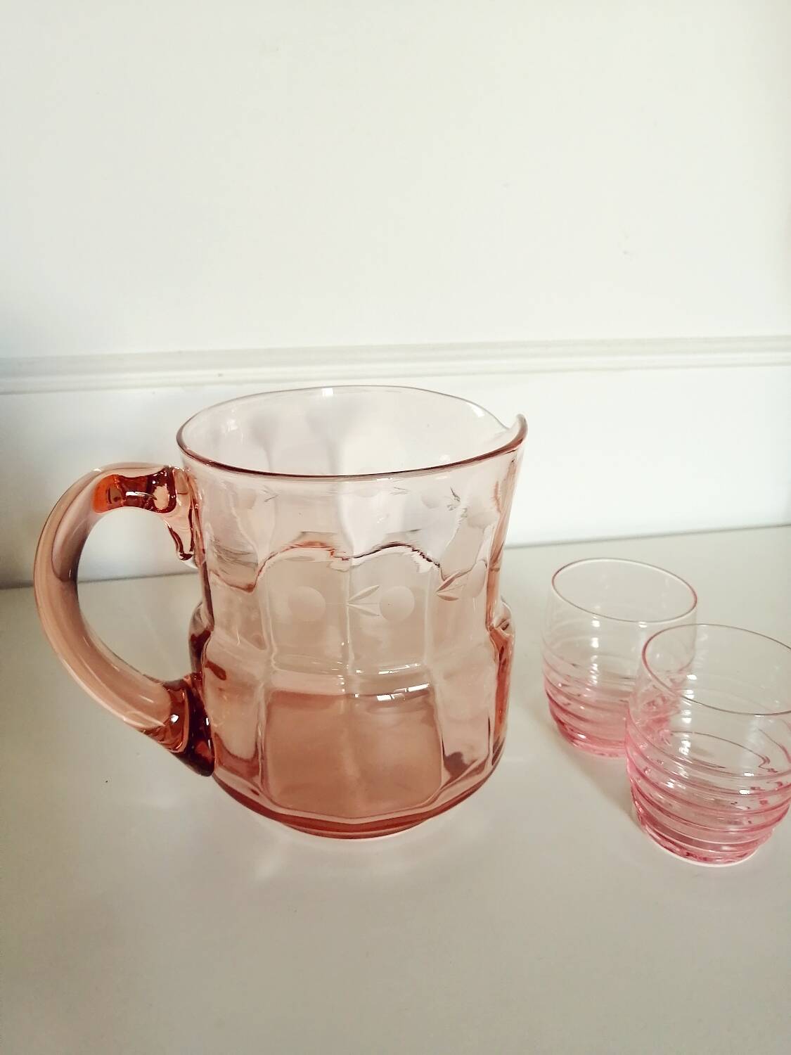 Pitcher and 2 glasses in pink glass