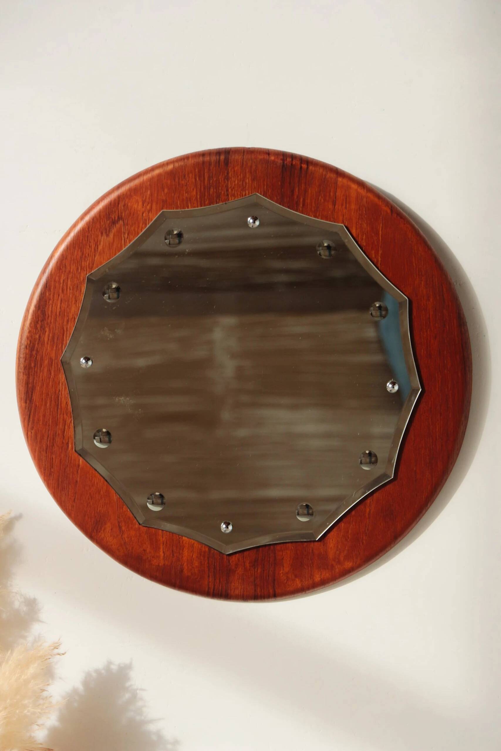 Vintage round teak mirror from the 1960s.