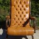 Fauteuils en bois et cuir capitonné, les 2