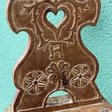 Old Swiss escabelle chair in carved wood