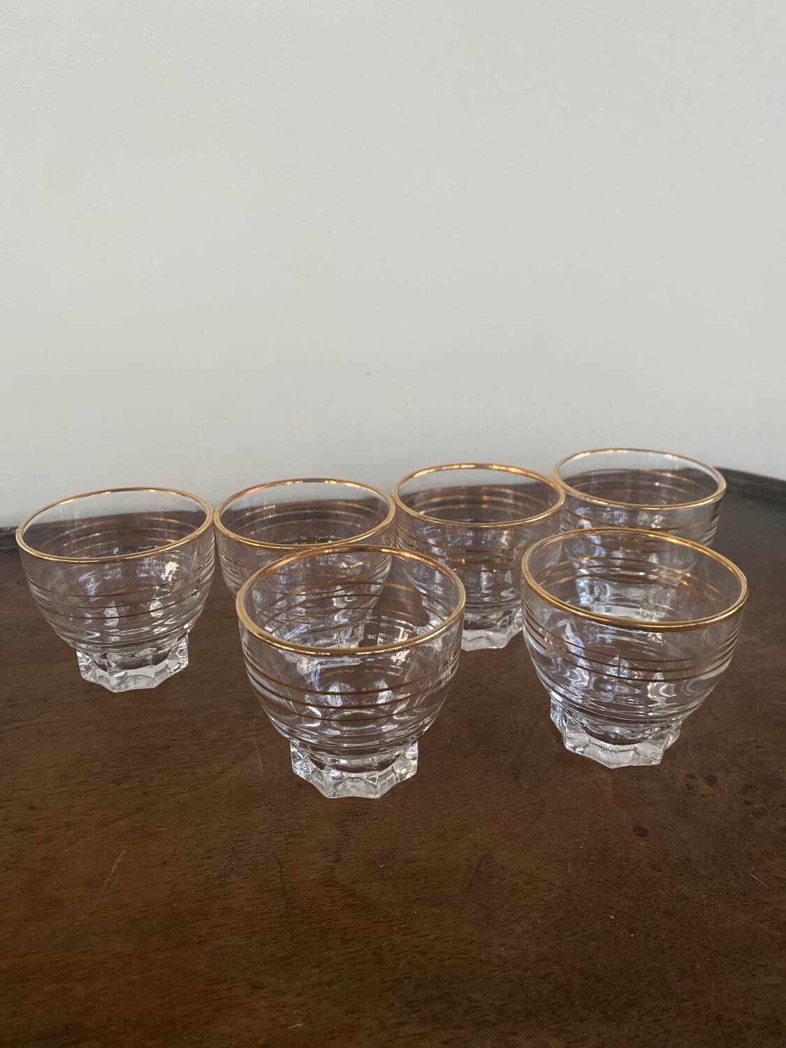 6 small golden glasses