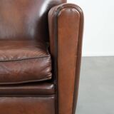 Armchair made of sheepskin leather in art deco design with warm colours