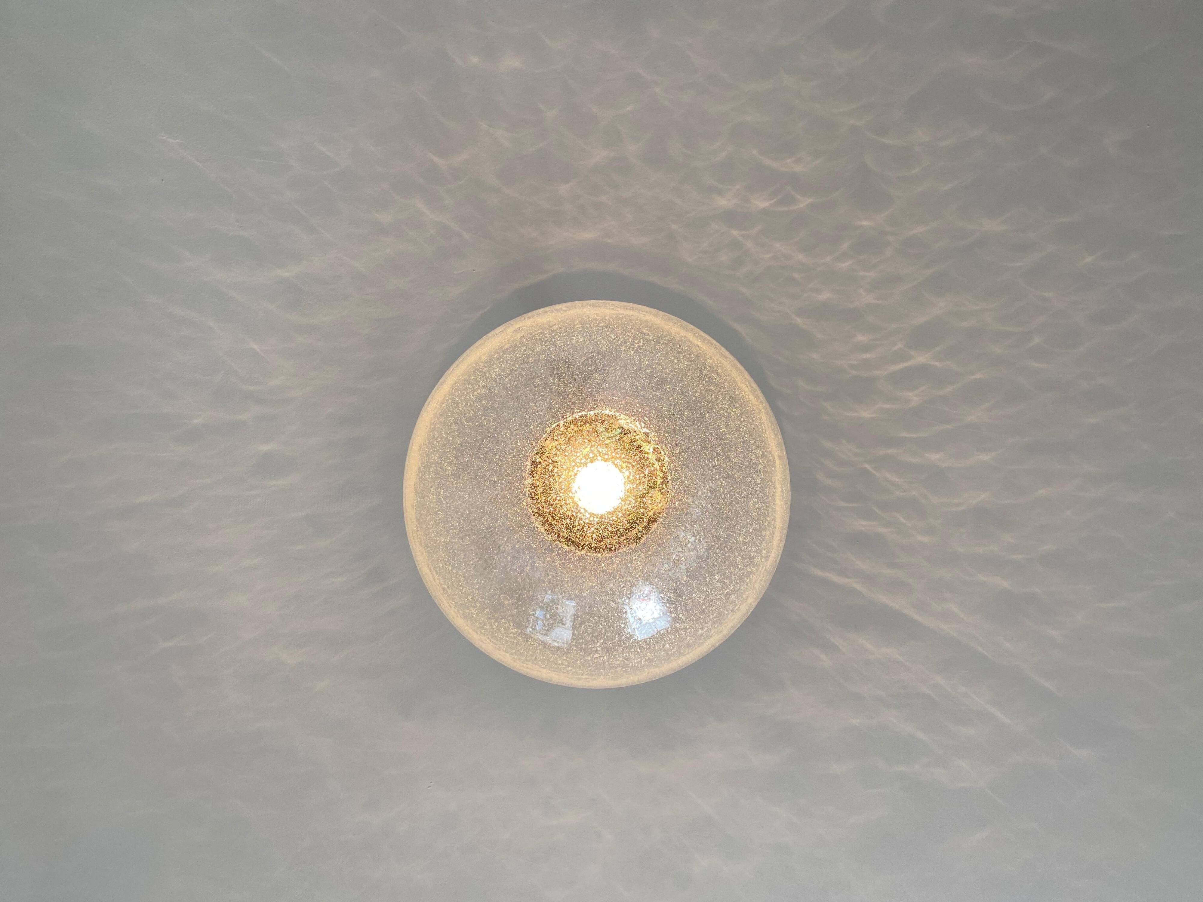 Large glass globe pendant light with bubbles and chrome by Peil & Putzler, Germany, 1970s.