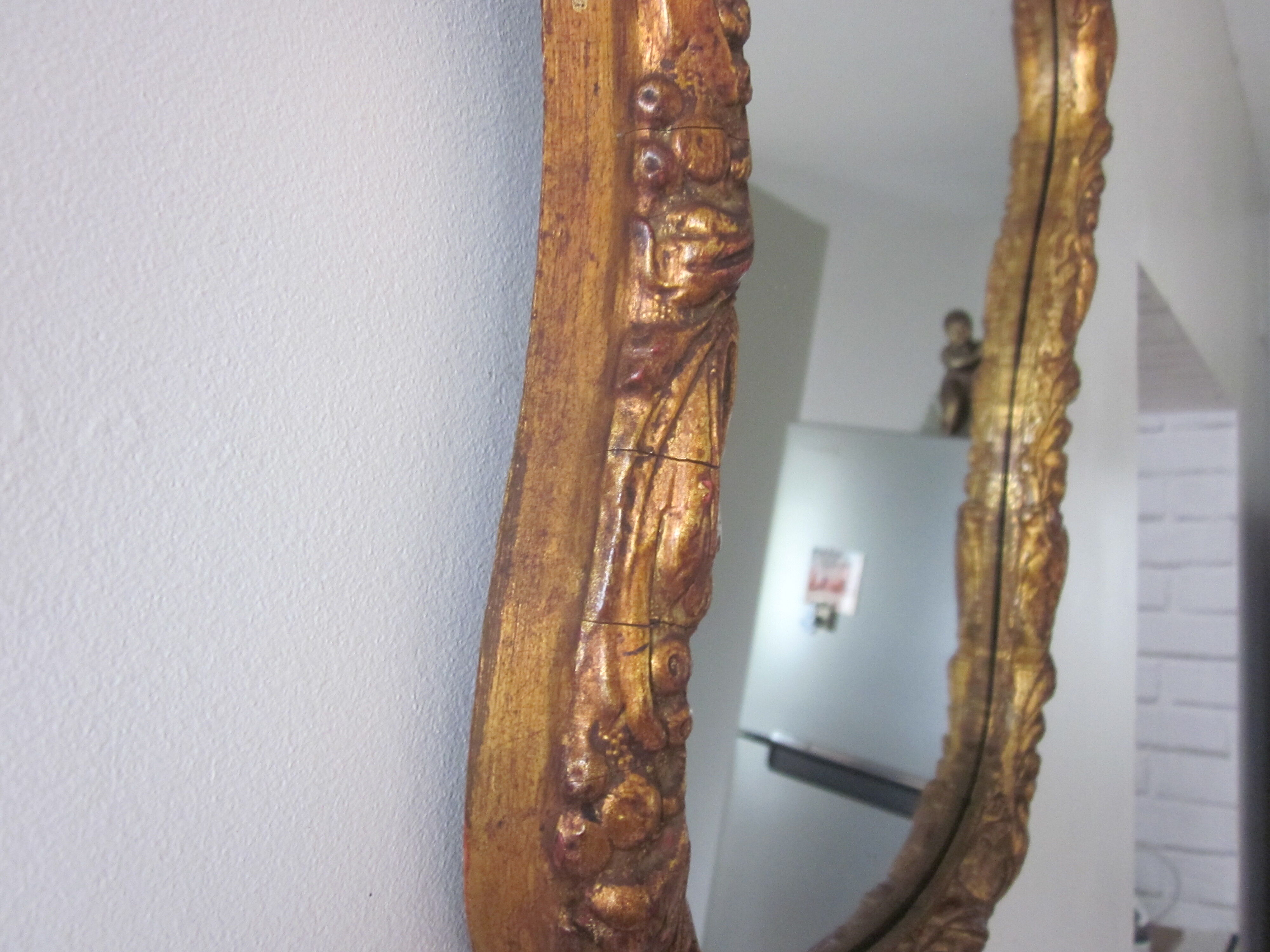 Old mirror in wood and stucco dorè