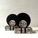 Art Deco bookends with a circular design in black and pink marble.