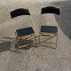 Two chairs, similar black
