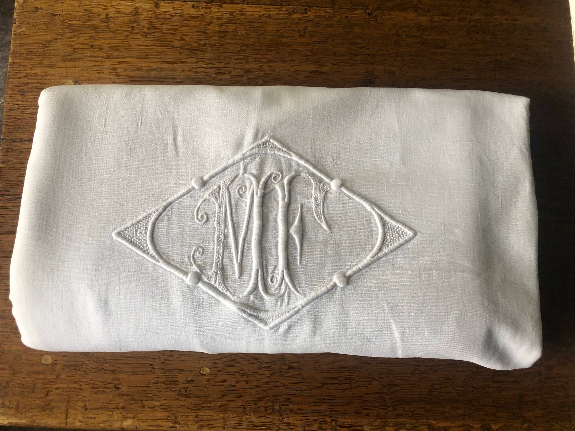 Similar listings: Antique cotton sheet embroidered with the monogram MF