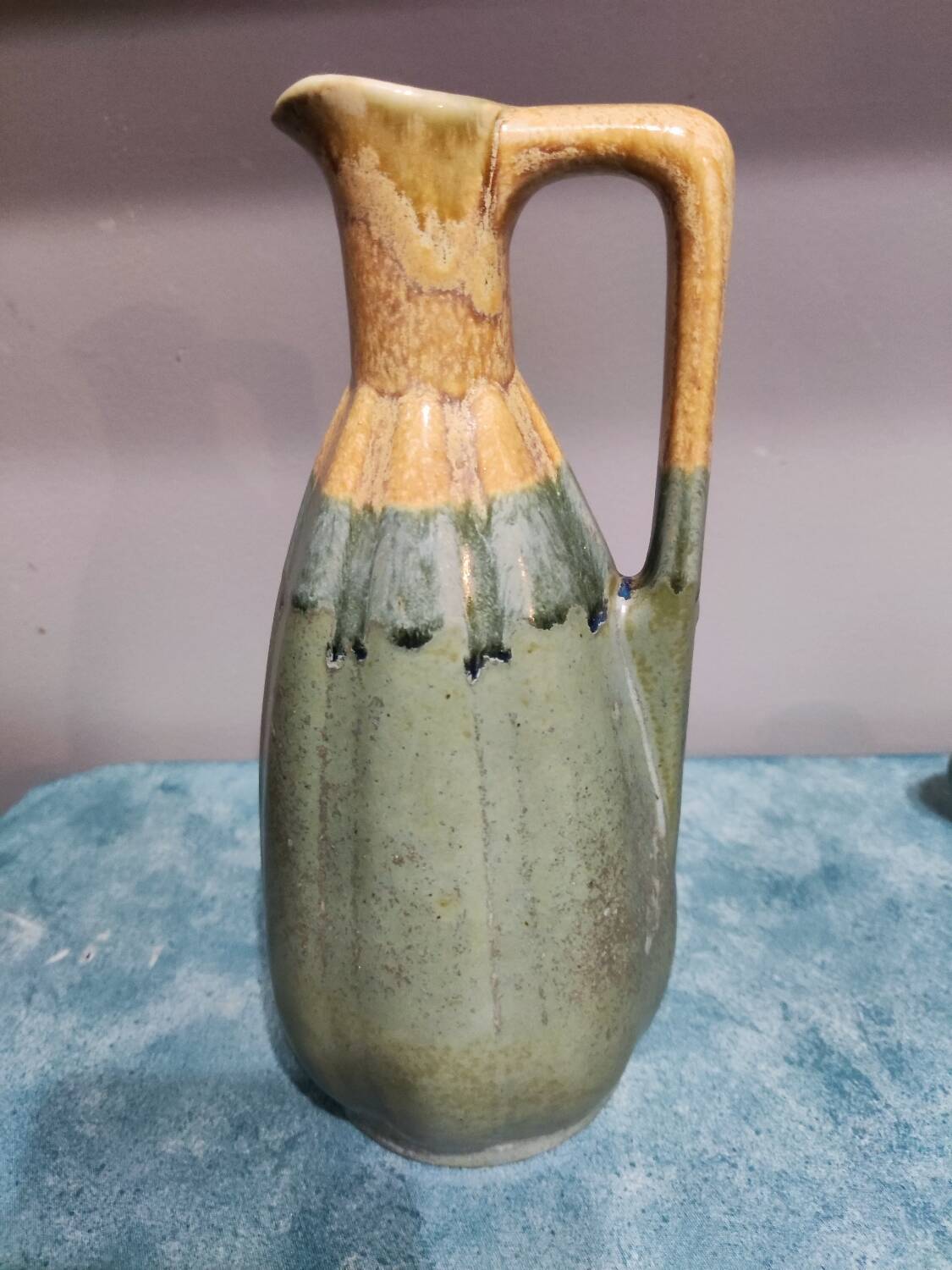 Two enameled stoneware pitchers