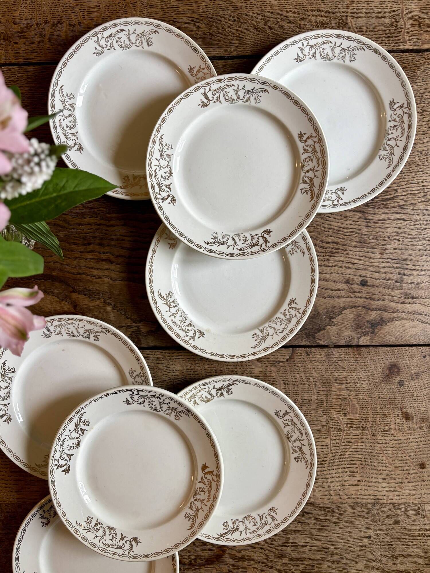 Set of 8 vintage white and gold dessert plates.