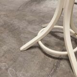 Parrot wears white Baumann coat 1970