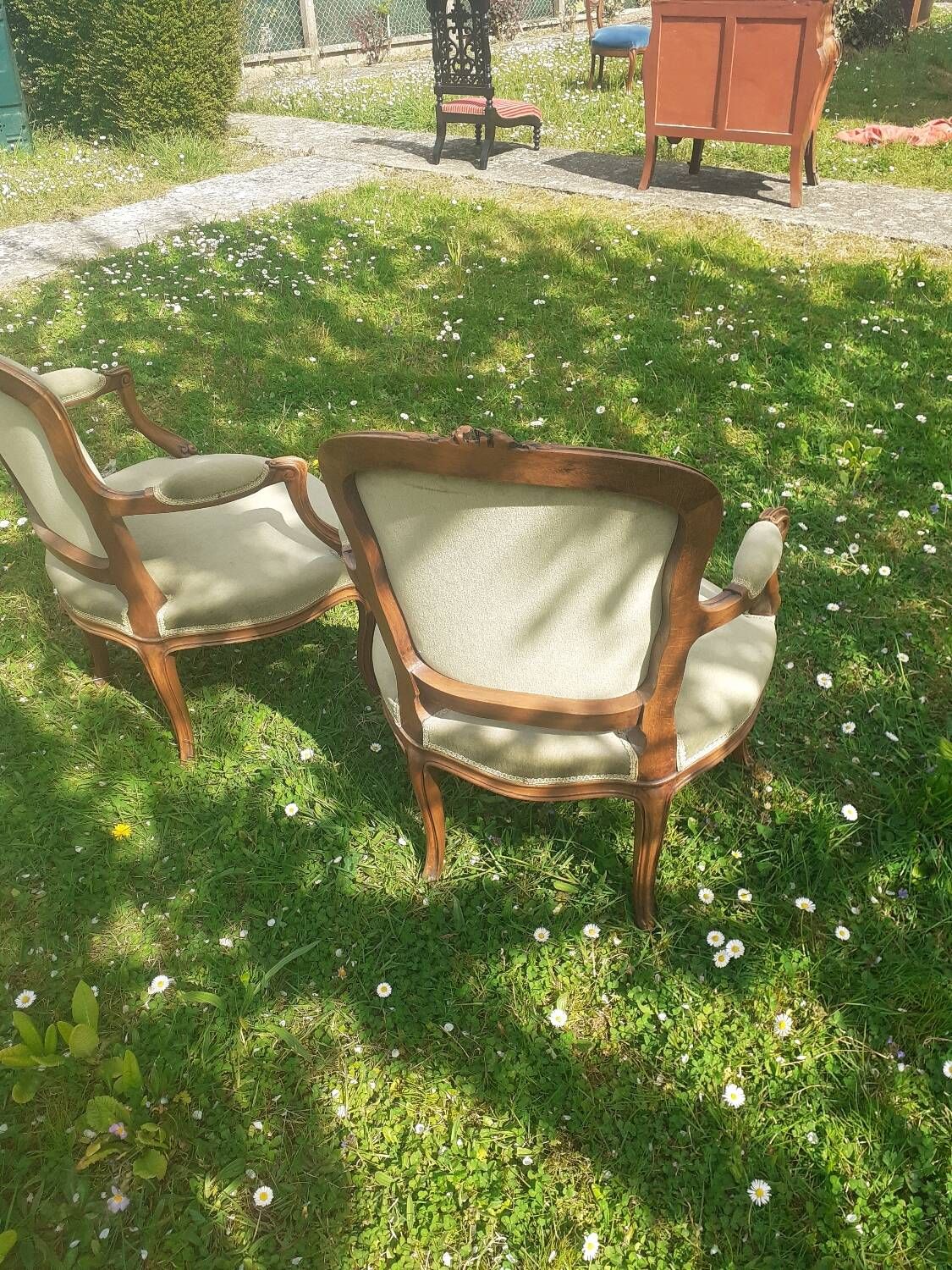 Pair of Rocaille style armchairs in green fabric and walnut, 19th century