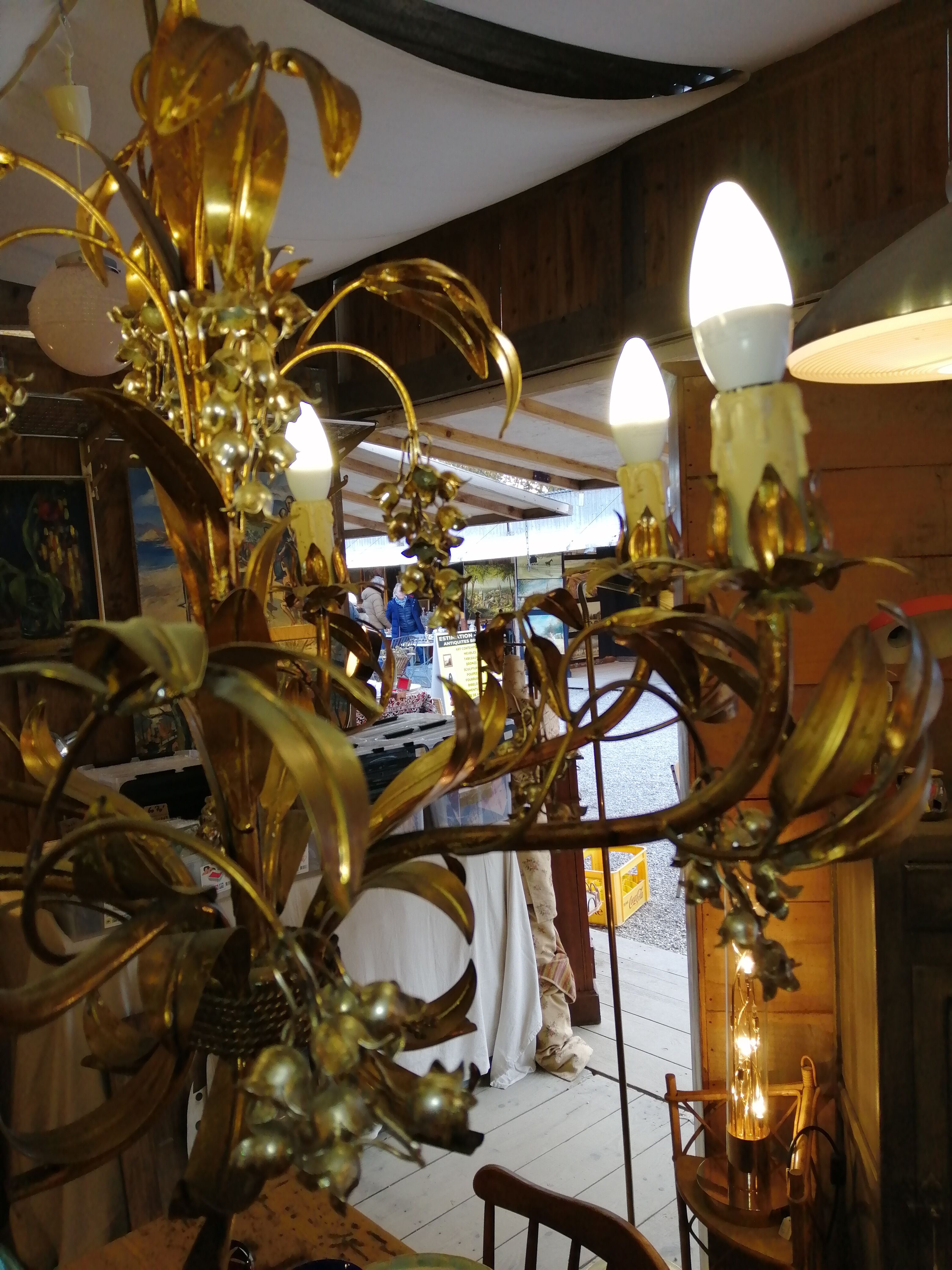 Gilded brass chandelier and silver lily of the valley bells