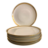 7 flat plates in porcelain of Limoges Bernardaud, decoration of golden Greek, XXth century