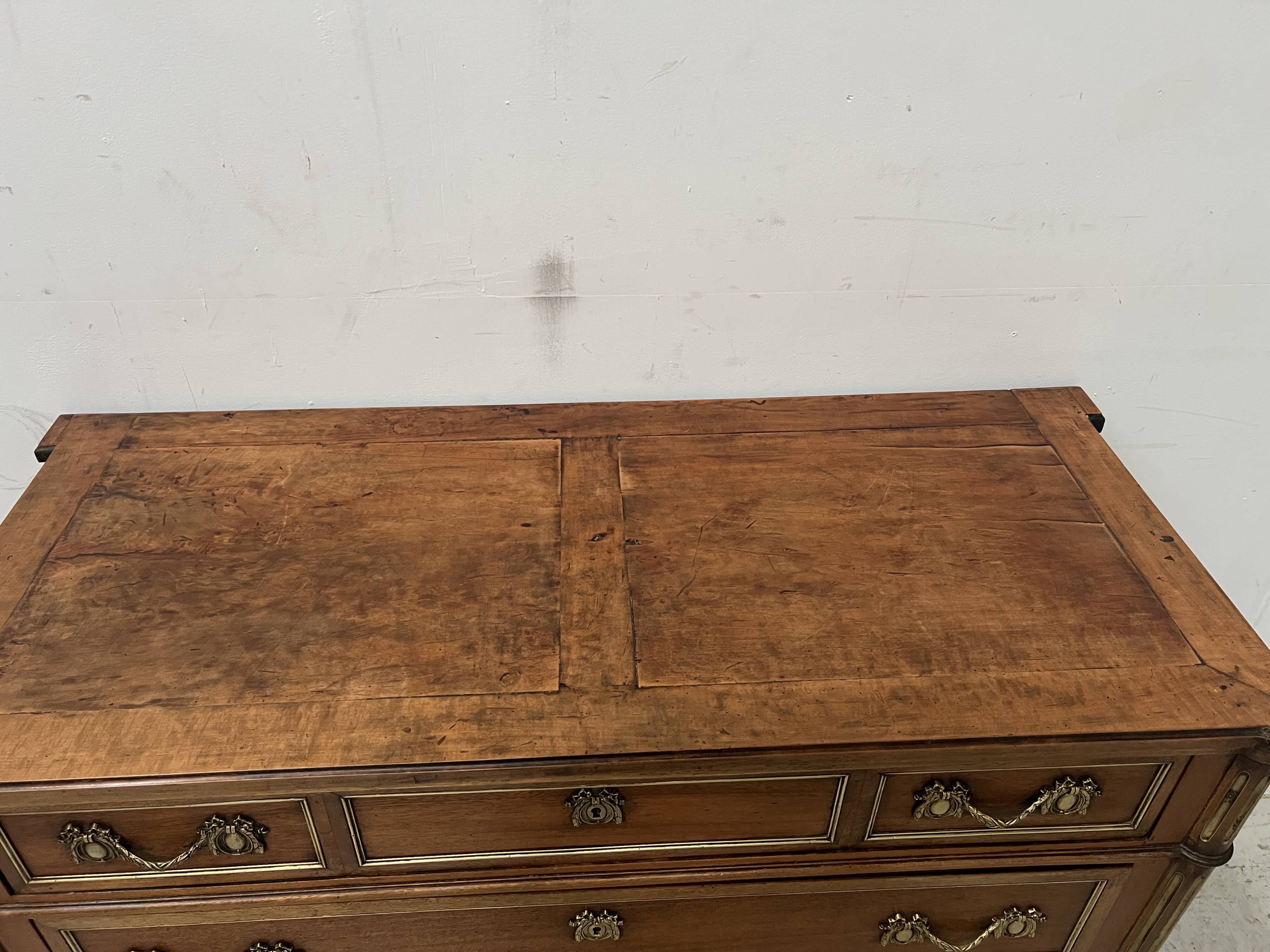 Louis XVI style mahogany commode with a grey veined marble top, 19th century
