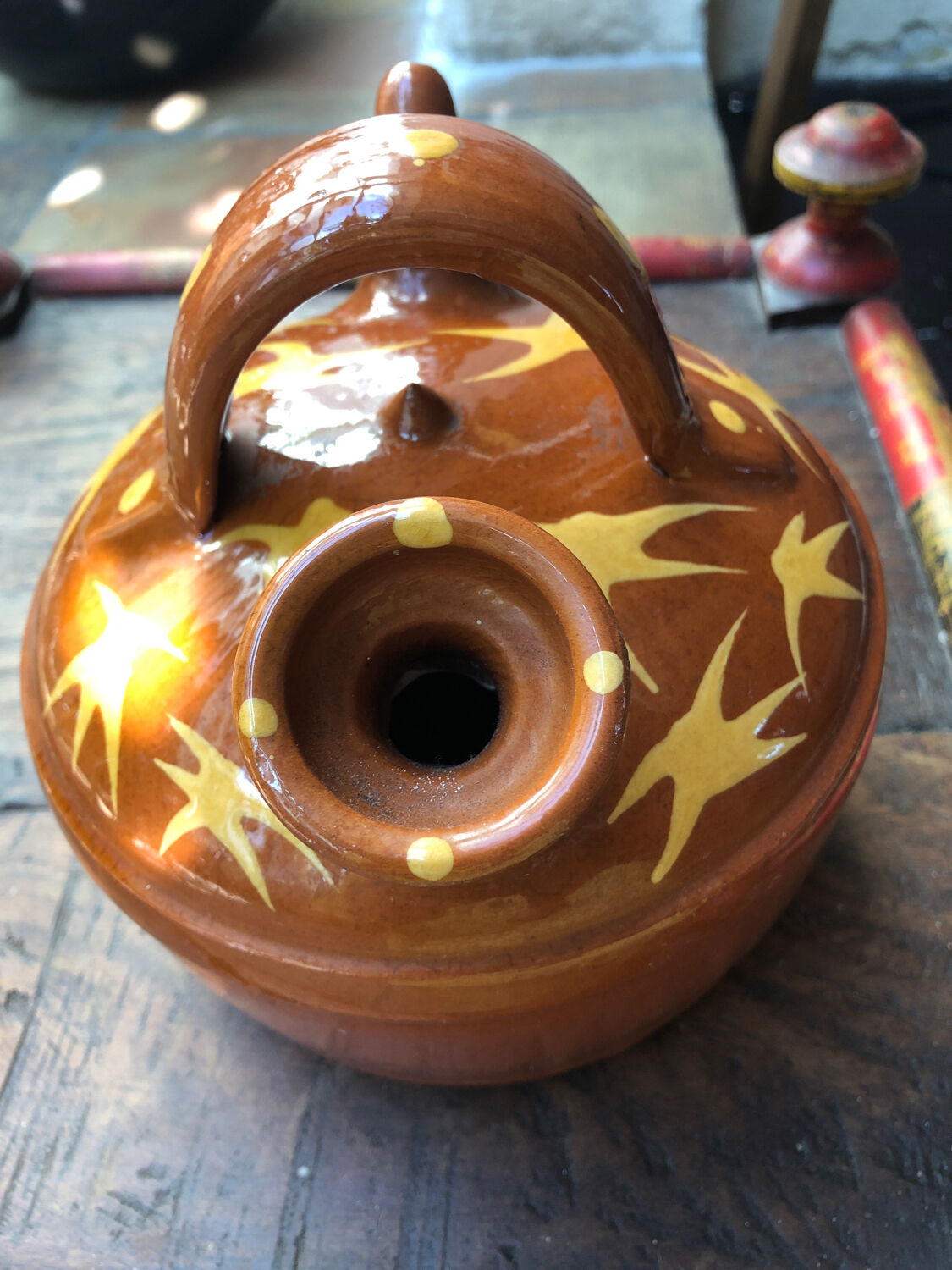 Orange glazed terracotta gargoulette